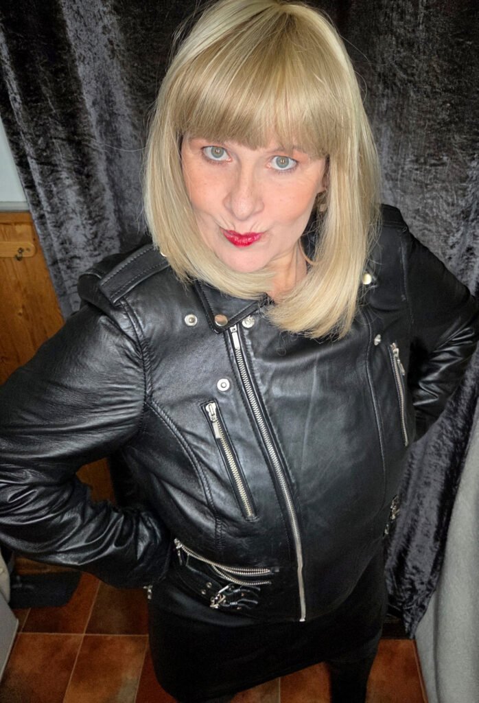 mrs leather posing in leather biker jacket