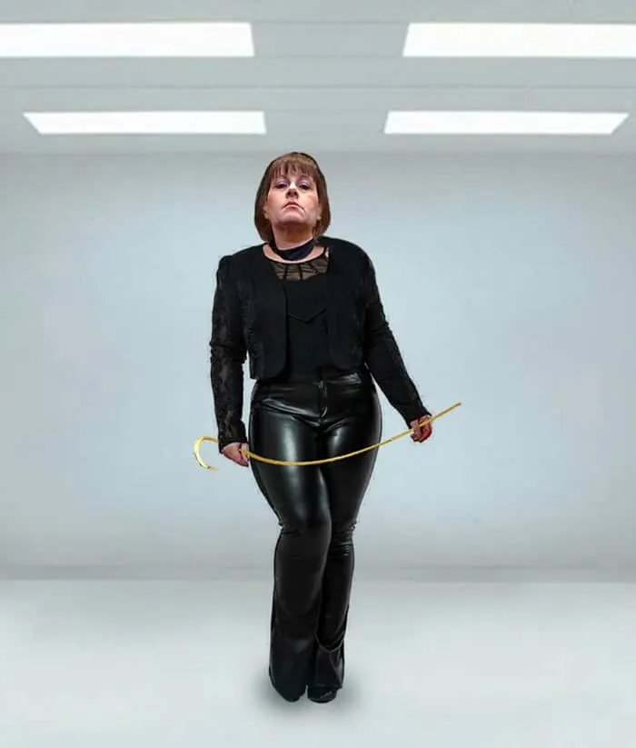 dominatrix wearing black leather trousers holding whip